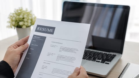 A polished resume displayed on a laptop